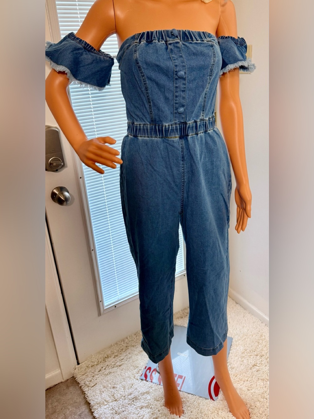 VENUS Off-Shoulder Denim Jumpsuit in Medium Blue. NWOT